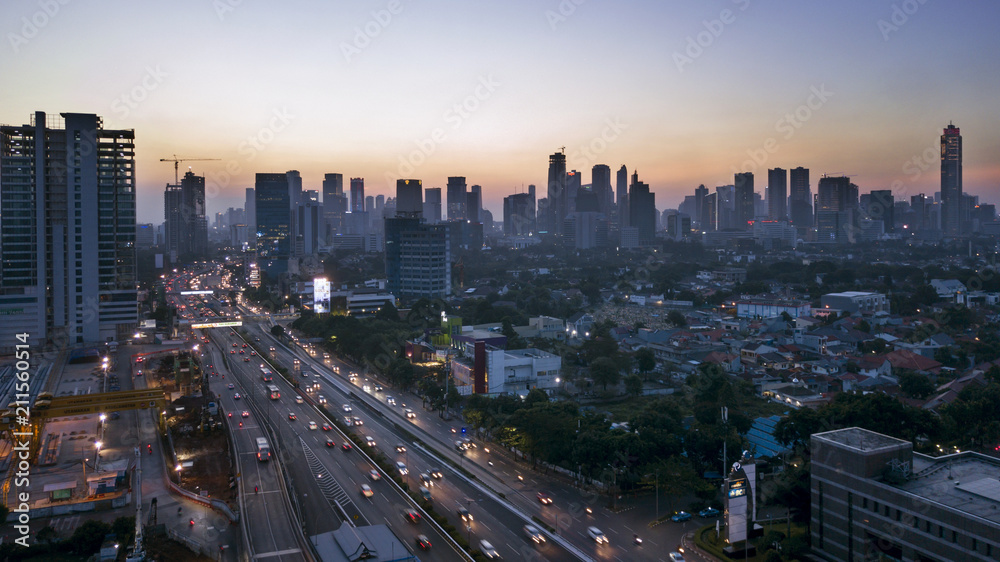 Beautiful cityscape with busy road at sunset time