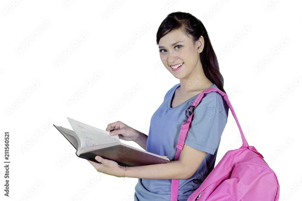 Beautiful college student reading a book on studio Beautiful college student reading a book on studio