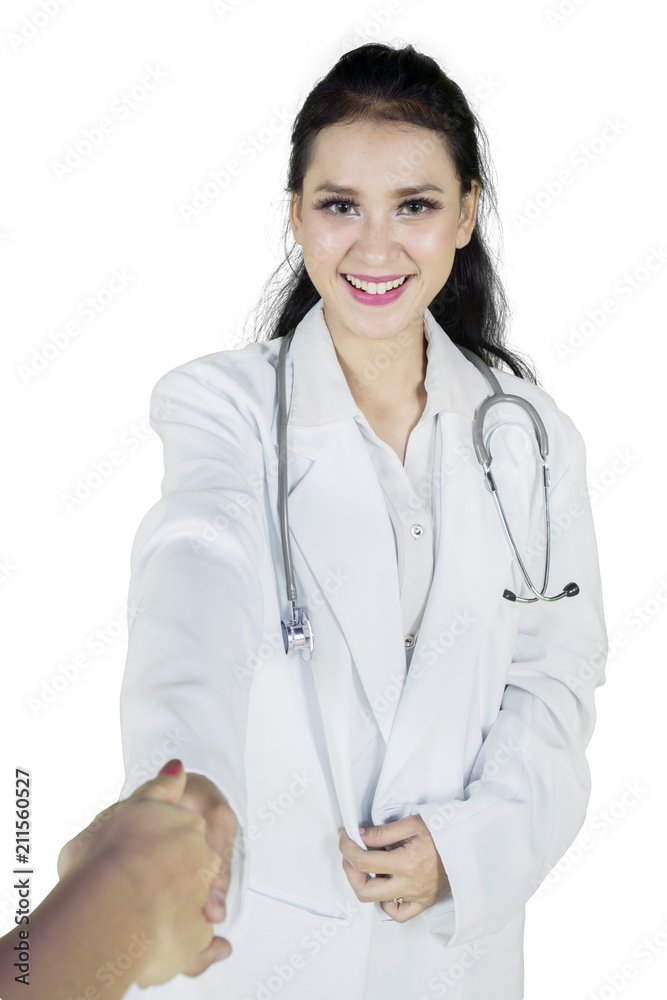 Beautiful doctor shaking hands with her patient Beautiful doctor shaking hands with her patient