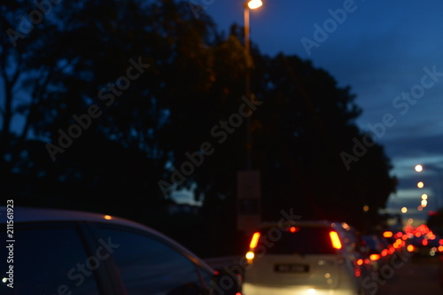 De-focus of bokeh light from cars on the traffic road with space for your text and design. Concept be used for transportation, traffic jam news and background. Blur picture.
