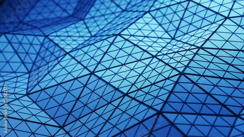 Blue low poly triangulated shape with subdivided polygons. Futuristic abstract distorted construction. Seamless loop 3D render animation 4k UHD 3840x2160
 photo