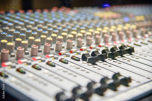 Close up of  digital sound audio mixer and amplifier equipment or music mixer equalizer console. Sound technician audio mixer equalizer control for background. studio music recording concept