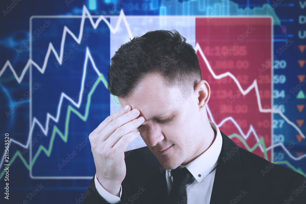 Young manager with declining finance graph Young manager with declining finance graph