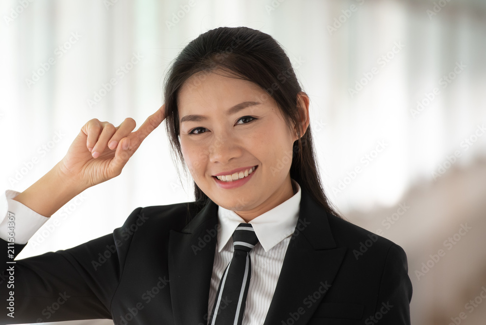 Young Asian working woman thinking, having good ideas pose at the office. Young Asian working woman thinking, having good ideas pose at the office.