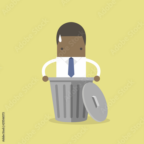 African businessman dropped into trash. photo