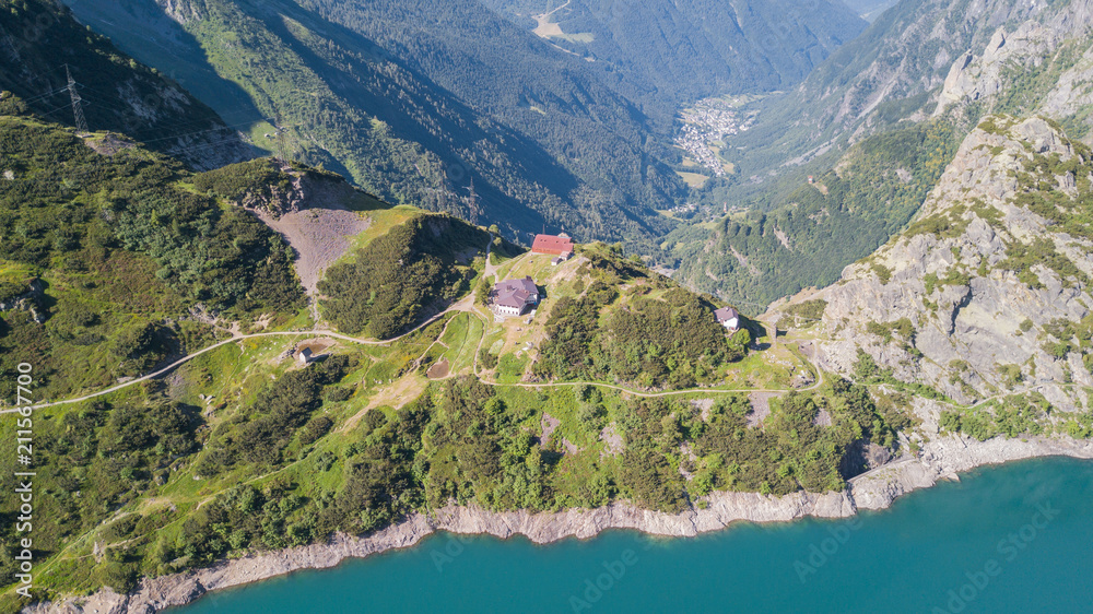 Drone aerial view of the Lake Barbellino and the shore. An Alpine artificial lake. Italian Alps. Italy