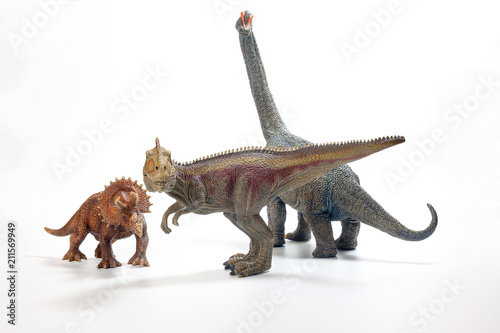 Fototapeta Naklejka Na Ścianę i Meble -  Tyrannosaurus Triceratops Brachiosaurus Dinosaur Toy figurine on white background