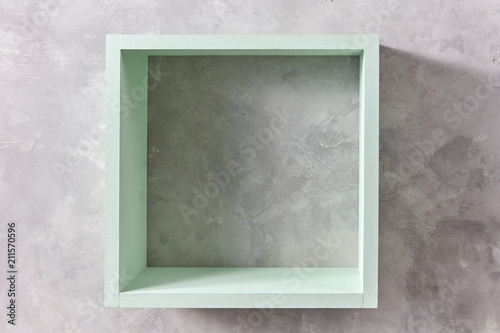 Box shelf isolated on stone gray background.