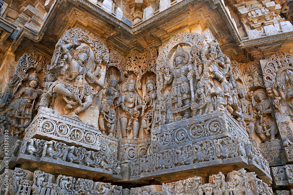 Sculptures west side walls. Shiva on the left and Vishnu on the right. Hoysaleshwara temple, Halebidu, Karnataka. view from West.