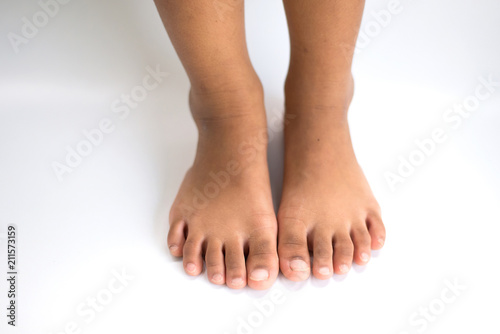 Feet Both bare feet pedal on a white background.