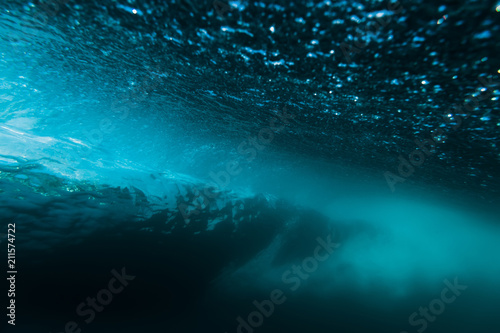 Breaking barrel wave in underwater.
