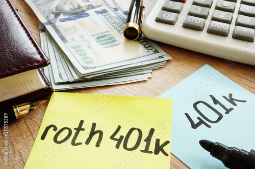 Two memo sticks roth 401k on a desk. Retirement. photo