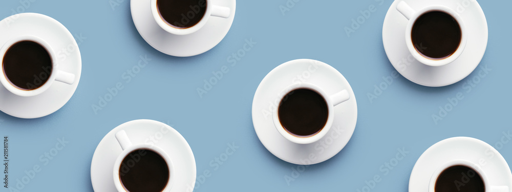 Many cups of coffee on blue background. Top view, banner for site. Many cups of coffee on blue background. Top view, banner for site.