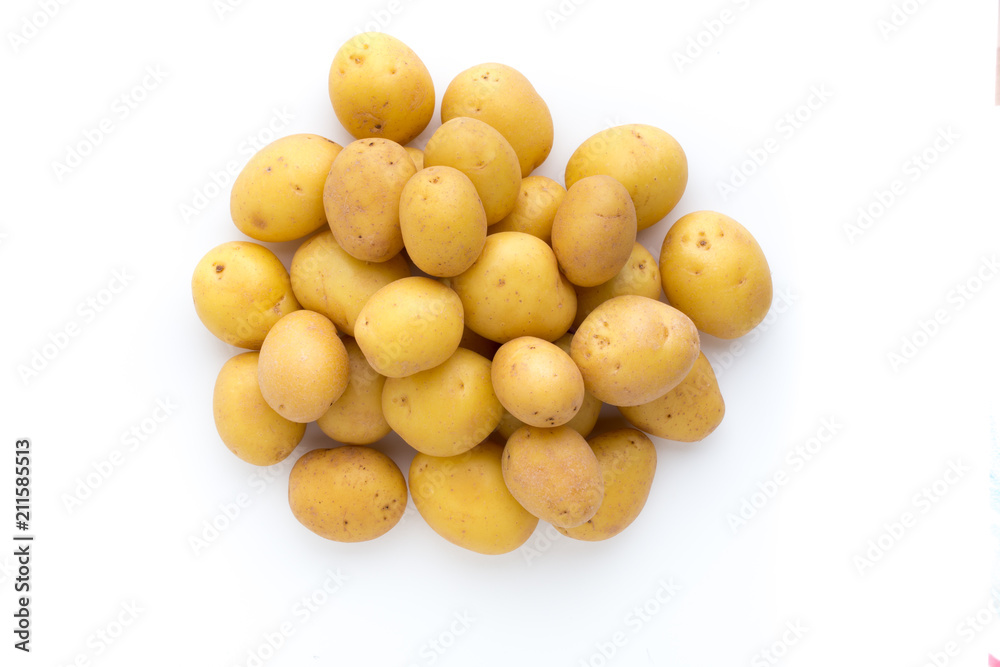 Young potato isolated on white background. Harvest new. Flat lay, top view Young potato isolated on white background. Harvest new. Flat lay, top view
