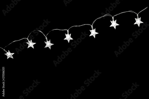 Christmas lights isolated on black background. Flat lay  top view  copy space