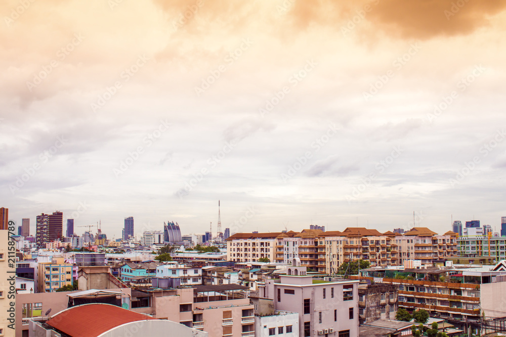 Bird view over cityscape with sun and clouds in the morning.Copy space.Bangkok.Pastel tone.