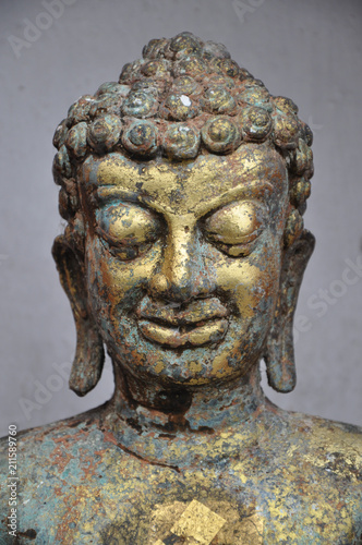 Close up image of bronze buddha statue 