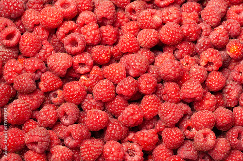 Ripe and Fresh Raspberries as a Background.