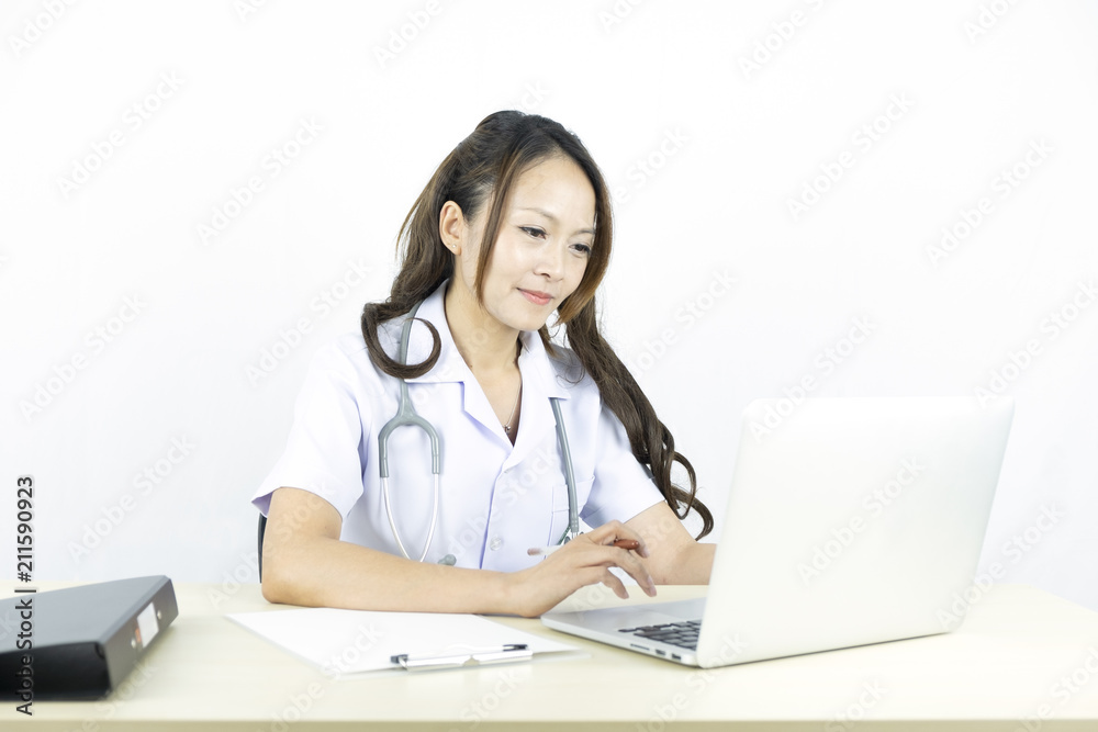 Smiling asian woman doctor working on computer laptop. Smiling asian woman doctor working on computer laptop.