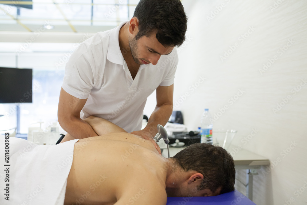 physiotherapist applying massage physiotherapist applying massage