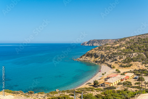 Fototapeta Naklejka Na Ścianę i Meble -  View direction south-east coast on Gavdos, to the beach of Korfos with guest house and tavernas