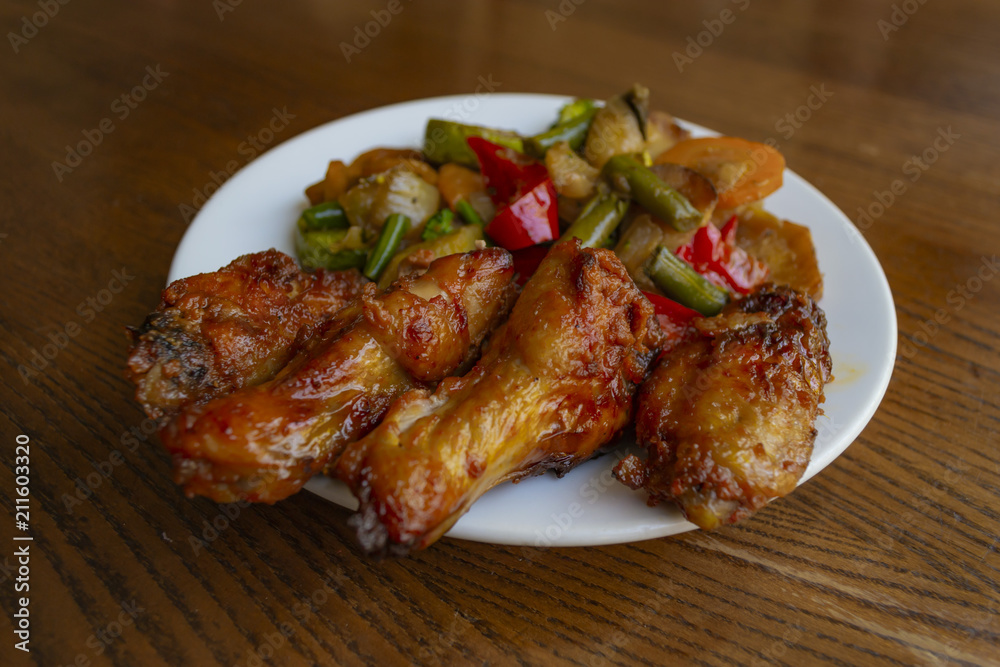 Spicy chicken wings with stewed vegetables. Spicy chicken wings with stewed vegetables.