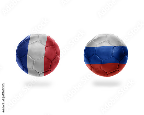 football balls with national flags of france and russia.