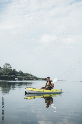 Sportsman Kayaking on the River