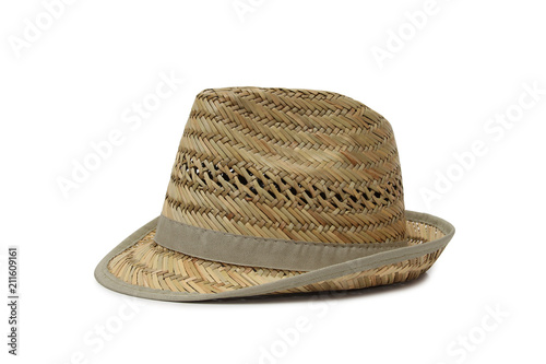 Old straw hat on a white background