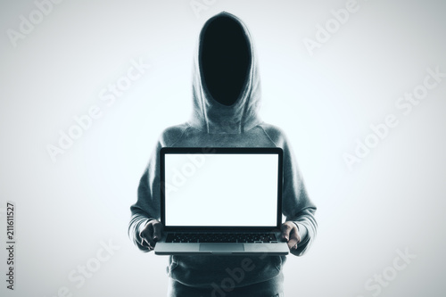 no face hacker and laptop