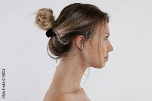 Portrait of young woman tattoo on her neck. Laser tattoo removal concept