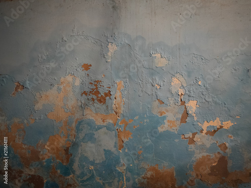 Shabby aged wall background in paint flakes