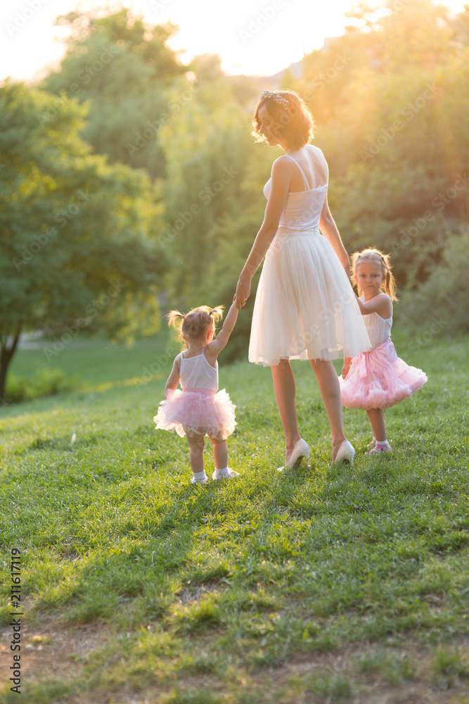 Naklejka premium mom and two daughters