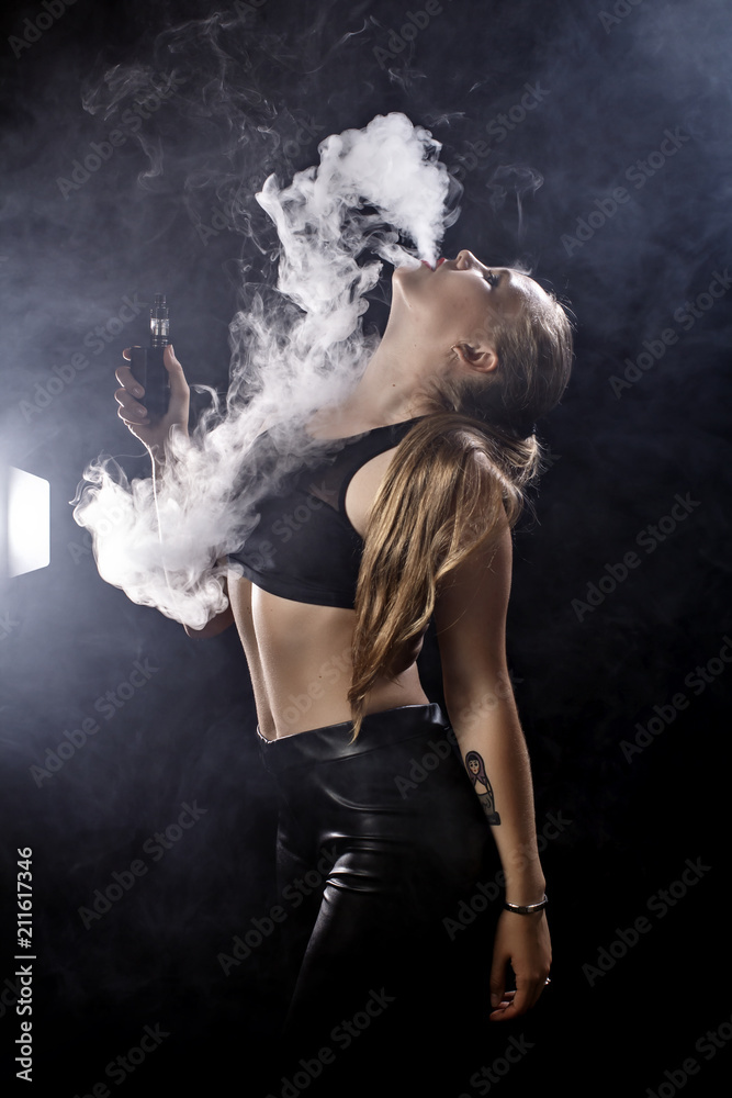 Girl soars on a black background vape