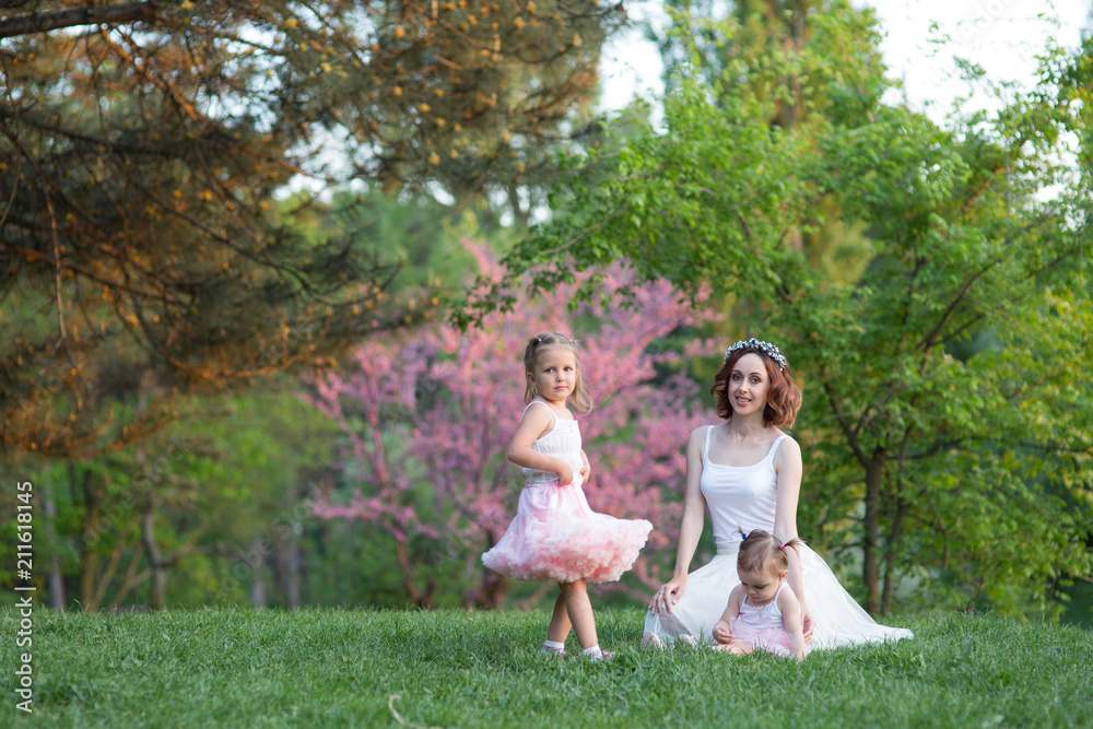 Obraz premium mom and two daughters