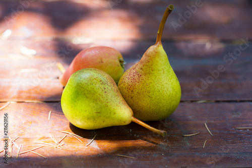 Fresh organic pears on rustic wooden table