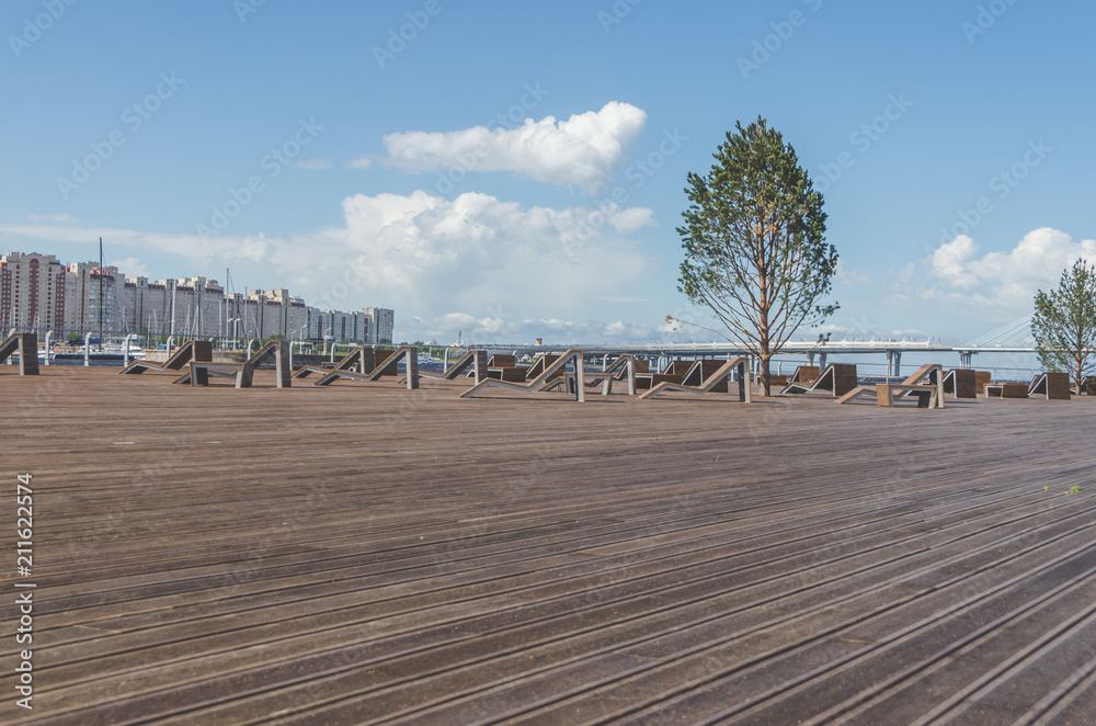 wooden promenade with benches