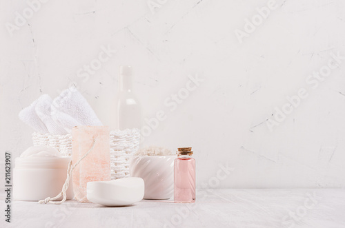 Luxury organic body and skin care spa cosmetics collection, pink oil and natural bath accessories on white wood background.