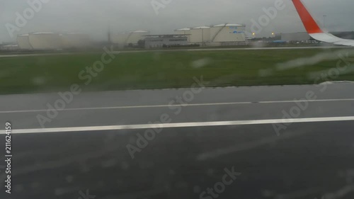 Departure from Amsterdam airport, rainy weather photo