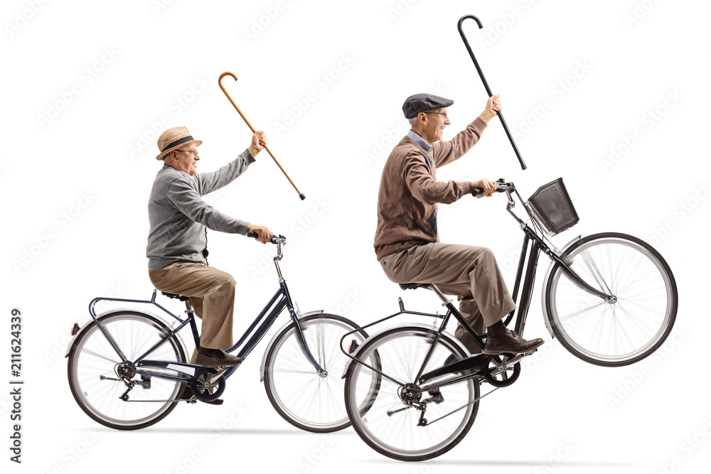 Seniors with canes riding bicycles with one of them doing a wheelie