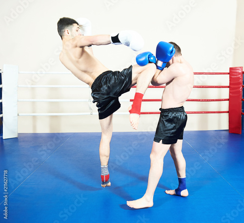Thai boxer fighting at training ring