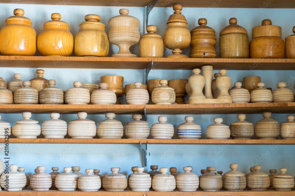 Group of wooden pot and jar for vegetable and food on shelf. Closeup. Group of wooden pot and jar for vegetable and food on shelf. Closeup.