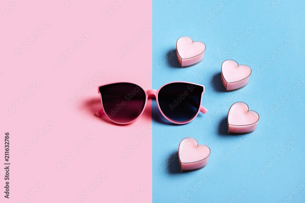 sunglasses isolated on a pink and blue background sunglasses isolated on a pink and blue background