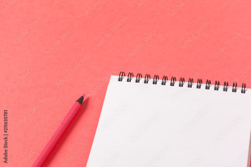 Blank paper pieces on a colored pink background Blank paper pieces on a colored pink background