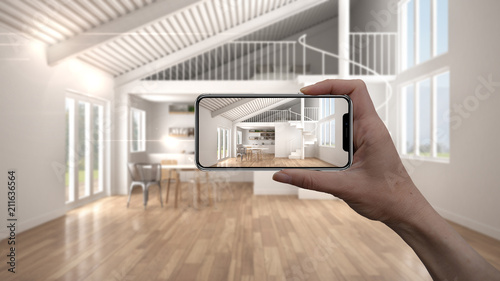 Hand holding smart phone, AR application, simulate furniture and interior design products in real home, architect designer concept, blur background, modern living room with kitchen photo