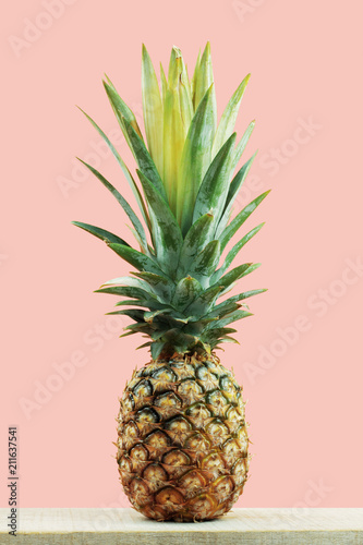 pineapple with pink background.