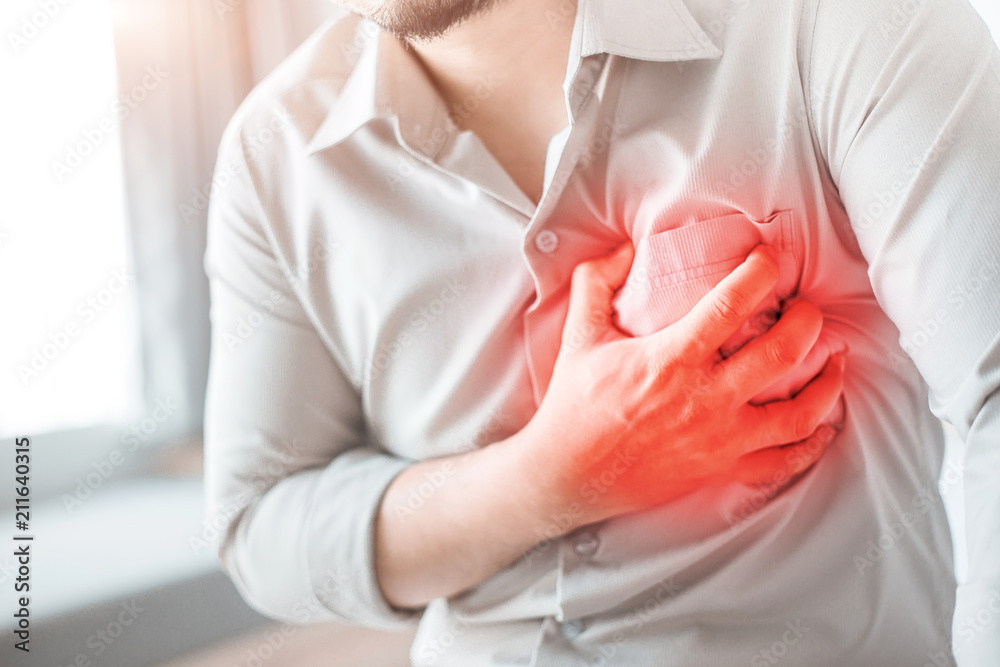 Obraz premium Man having severe chest pain, suffering from heart attack.