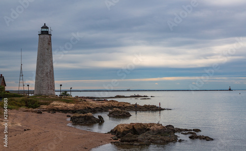 Lighthouse with beach and fisher men