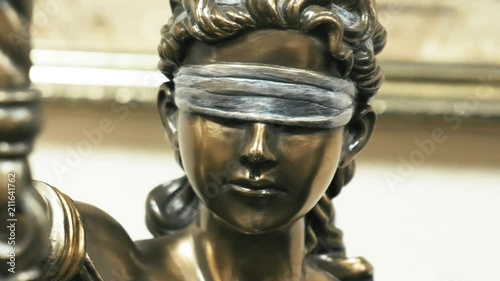 Themis bronze statue face close up photo