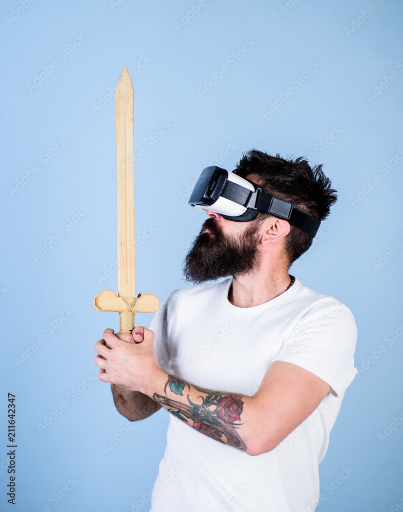 Hipster on serious face enjoy play game in virtual reality. Gamer concept.  Guy with head mounted